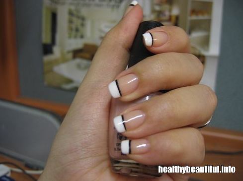 Classic French manicure with a thin black line along the tips