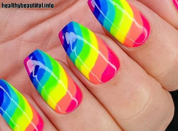 Thin, parallel lines in rainbow colors for a vibrant and fun manicure
