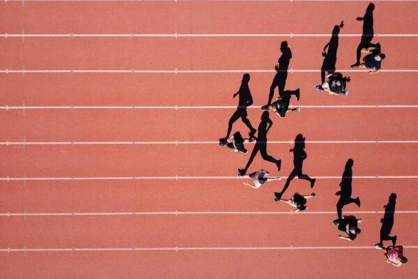 group of people running on stadium